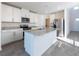 Open-concept kitchen with granite countertops, stainless steel appliances, and island at 2506 Linda Knoll Ln, Bartow, FL 33830