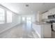 Spacious living room featuring tile floors and sliding glass doors to the backyard at 2506 Linda Knoll Ln, Bartow, FL 33830