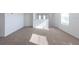 Bright loft with plush carpet and plenty of natural light from the windows at 2506 Linda Knoll Ln, Bartow, FL 33830