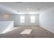 Bright loft with plush carpet and plenty of natural light from the windows at 2506 Linda Knoll Ln, Bartow, FL 33830