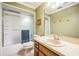 Bathroom with tiled shower and vanity at 9415 Cat Track Trl, Lake Wales, FL 33898