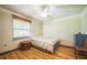 Cozy bedroom with hardwood floors and natural light at 9415 Cat Track Trl, Lake Wales, FL 33898