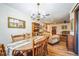 Open concept dining room flowing into living room with hardwood floors at 9415 Cat Track Trl, Lake Wales, FL 33898