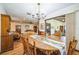 Dining room with seating for six overlooking the adjacent living room at 9415 Cat Track Trl, Lake Wales, FL 33898