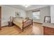 Main bedroom with hardwood floors, natural light, and tasteful decor at 9415 Cat Track Trl, Lake Wales, FL 33898