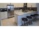 Modern kitchen featuring stainless steel appliances, granite countertops and breakfast bar at 2691 Cedaridge Cir, Clermont, FL 34711