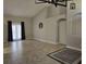 Spacious living room with high ceilings, tile flooring and large windows providing natural light at 2691 Cedaridge Cir, Clermont, FL 34711