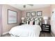 Inviting bedroom with decorative headboard, stylish nightstands, and soft, neutral tones at 5103 Bridgehaven Rd, Davenport, FL 33837