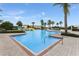 Resort-style community pool area with palm trees, water slides, and lounge chairs for residents to enjoy at 5103 Bridgehaven Rd, Davenport, FL 33837