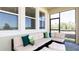 Relaxing screened patio with comfortable seating, stylish cushions, and views of the outdoors at 5103 Bridgehaven Rd, Davenport, FL 33837