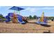 Fun community playground with slides, climbing structures, and soft ground cover for safety at 5103 Bridgehaven Rd, Davenport, FL 33837