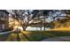 Scenic backyard view with lake, lush lawn, and mature trees, perfect for relaxation and outdoor enjoyment at 6372 Raleigh St # 1911, Orlando, FL 32835