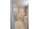A bathroom with dual shower heads, white tiles, and a bright vanity area is shown at 6372 Raleigh St # 1911, Orlando, FL 32835