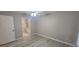 A bedroom features a ceiling fan and grey floors; the bathroom entrance is visible at 6372 Raleigh St # 1911, Orlando, FL 32835