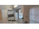 Functional kitchen featuring a granite countertop, white cabinets, and stainless-steel sink, perfect for cooking at 6372 Raleigh St # 1911, Orlando, FL 32835