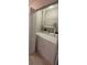 Efficient laundry area with white washer and dryer, and overhead shelving for storage convenience at 6372 Raleigh St # 1911, Orlando, FL 32835