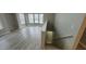 Inviting living room with large windows and modern gray flooring for ample natural light at 6372 Raleigh St # 1911, Orlando, FL 32835