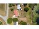 Top-down aerial of a house and its surrounding yard and a small dock on a lake at 5020 Old Lucerne Park Rd, Winter Haven, FL 33881