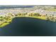 Panoramic aerial vista of a lakeside community with stunning water views and lush landscapes at 5020 Old Lucerne Park Rd, Winter Haven, FL 33881