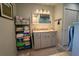 Clean bathroom with a grey vanity, granite countertop, and linen storage at 5020 Old Lucerne Park Rd, Winter Haven, FL 33881