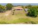 Charming single-story home with a red roof and a spacious, well-maintained lawn at 5020 Old Lucerne Park Rd, Winter Haven, FL 33881