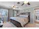 Charming bedroom with lake views, cozy rug, and ensuite bathroom access at 830 County Rd 457, Lake Panasoffkee, FL 33538