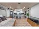 Open floor plan featuring a living room connected to a bright kitchen at 830 County Rd 457, Lake Panasoffkee, FL 33538