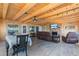 Spacious living room featuring a brick fireplace, lake views, and a dining area at 830 County Rd 457, Lake Panasoffkee, FL 33538