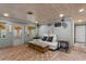 Cozy living room featuring a sofa and a view of the waterfront property at 830 County Rd 457, Lake Panasoffkee, FL 33538