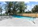Backyard pool with lots of deck space and lounge chairs at 830 County Rd 457, Lake Panasoffkee, FL 33538