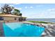 Backyard pool view of lake and home at 830 County Rd 457, Lake Panasoffkee, FL 33538