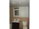 Cozy bathroom features a sink, toilet, and bathtub with a tiled wall and overhead lighting at 102 Se 6Th Ave, Mulberry, FL 33860