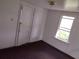 Bright bedroom offers potential for customization with a window view and ample space for furnishings at 102 Se 6Th Ave, Mulberry, FL 33860