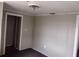 Plain room with carpet and light green walls offers a blank canvas for personalization and design at 102 Se 6Th Ave, Mulberry, FL 33860