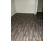 This room showcases laminate flooring, offering a clean and modern aesthetic throughout the space at 102 Se 6Th Ave, Mulberry, FL 33860