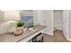 Dedicated home office space with a desk, stool, and adjacent bathroom featuring modern fixtures and finishes at 1906 Clear Sky Dr, Kissimmee, FL 34744