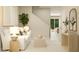 Inviting living room with neutral tones, a cozy white sofa, and a view into dining area at 2947 Savior Ave, Davenport, FL 33837
