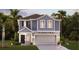 Charming two-story home with a well-manicured lawn, two-car garage, and inviting entryway at 5625 Gingham Dr, Kissimmee, FL 34758