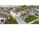 Aerial view of a lovely two-story home, situated in a beautiful neighborhood with a lake nearby at 1532 Axel Cir, Winter Haven, FL 33880