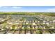 Panoramic aerial view of the community featuring neatly arranged homes, serene lakes, and lush greenery at 1532 Axel Cir, Winter Haven, FL 33880