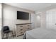 Bedroom featuring neutral walls and carpet, with TV mounted on the wall and closet doors out of view at 1532 Axel Cir, Winter Haven, FL 33880