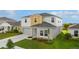 Beautiful home featuring a manicured lawn, a paved driveway, and a welcoming front entrance, perfect for families at 1532 Axel Cir, Winter Haven, FL 33880