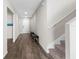 Entryway with wood flooring, a staircase, and a hallway to the front door at 1532 Axel Cir, Winter Haven, FL 33880