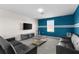 Spacious living room with modern furniture, TV, and grey carpet flooring at 1532 Axel Cir, Winter Haven, FL 33880