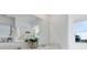 Well-lit bathroom boasts double sinks and large mirror above a quartz countertop at 5618 Gingham Dr, Kissimmee, FL 34758