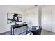 Contemporary office with a black desk, chairs, and a large abstract art piece at 5618 Gingham Dr, Kissimmee, FL 34758