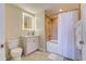 Well-lit bathroom showcases a shower-tub combo and a white vanity with modern fixtures at 13415 Blue Heron Beach Dr # 1201, Orlando, FL 32821