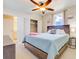 Bedroom with a large closet, a ceiling fan, a TV, and decor for relaxing comfort at 13415 Blue Heron Beach Dr # 1201, Orlando, FL 32821