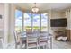 Dining area with large windows offering panoramic views, perfect for entertaining and enjoying meals at 13415 Blue Heron Beach Dr # 1201, Orlando, FL 32821