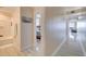 Hallway with the entrance to a bathroom, a bedroom and a distant view from the balcony at 13415 Blue Heron Beach Dr # 1201, Orlando, FL 32821